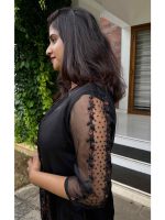 Black outfit paired with jacket - Image 2