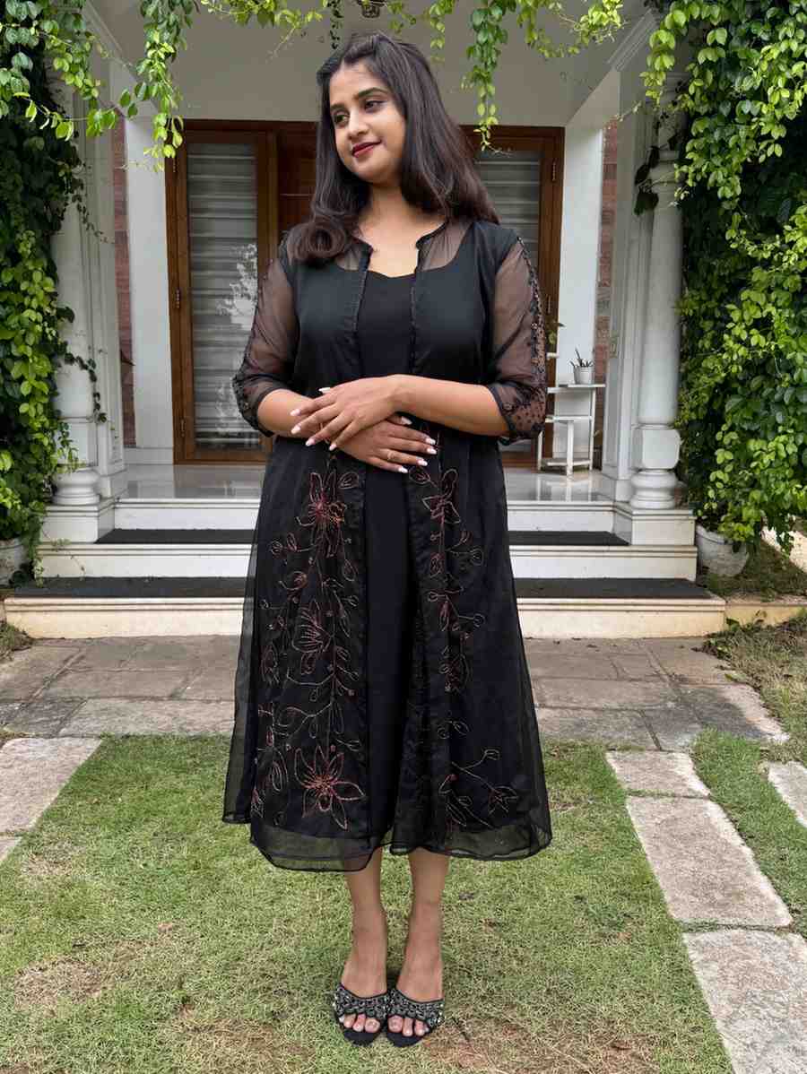 610654F9-7639-4522-BCA8-47A057012476 Black outfit paired with jacket - Image 1