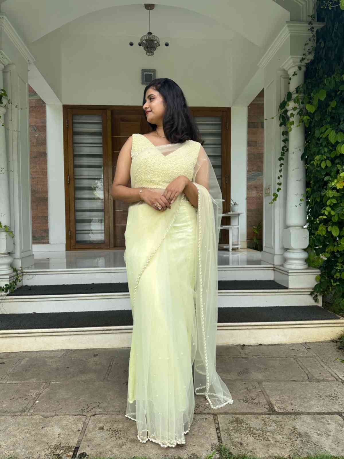 EFF2DBE3-8258-4974-A636-CDA6E1B65D9B Pastel yellow net saree - Image 1