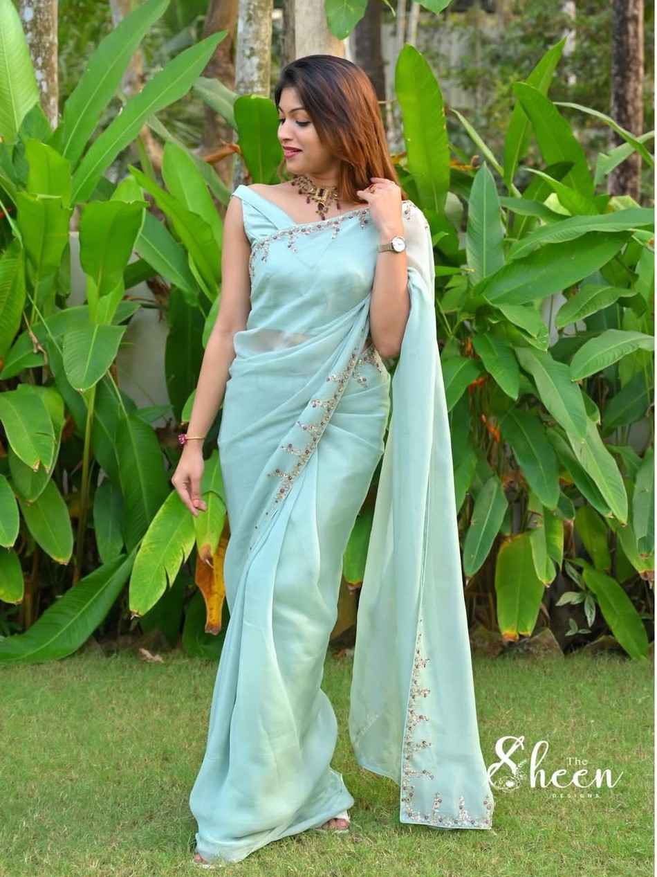 0C6DBA52-27CB-4584-A9FE-A33B7E506F1C (1) Sea green soft organza saree - Image 1